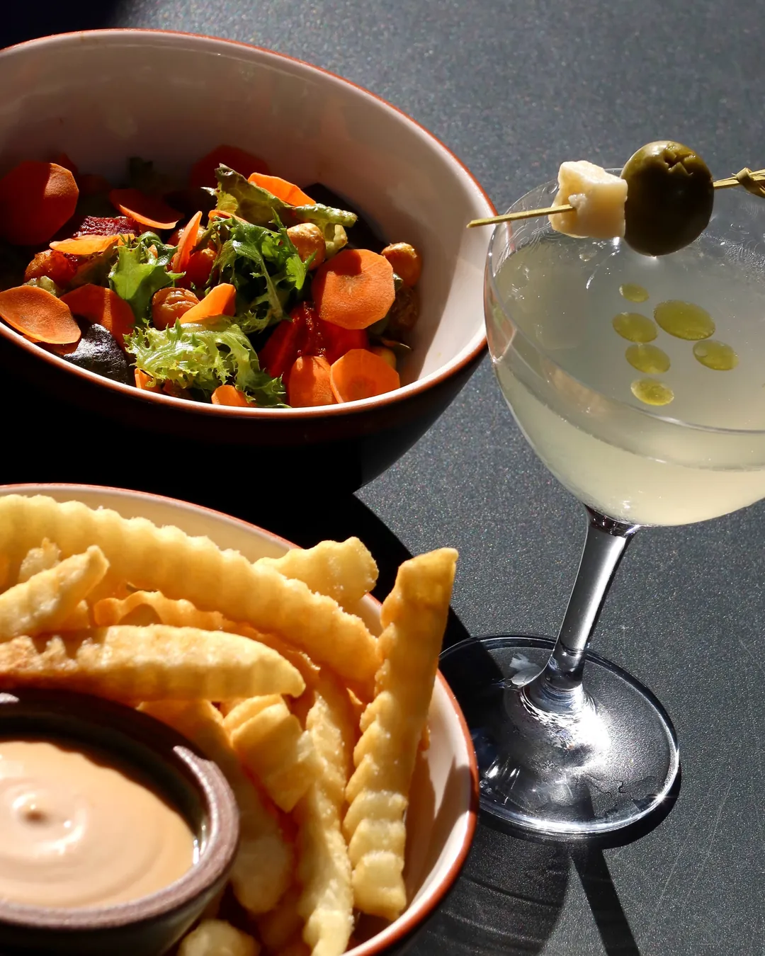Crinkle cut fries with fry sauce, harissa carrots, and a martini