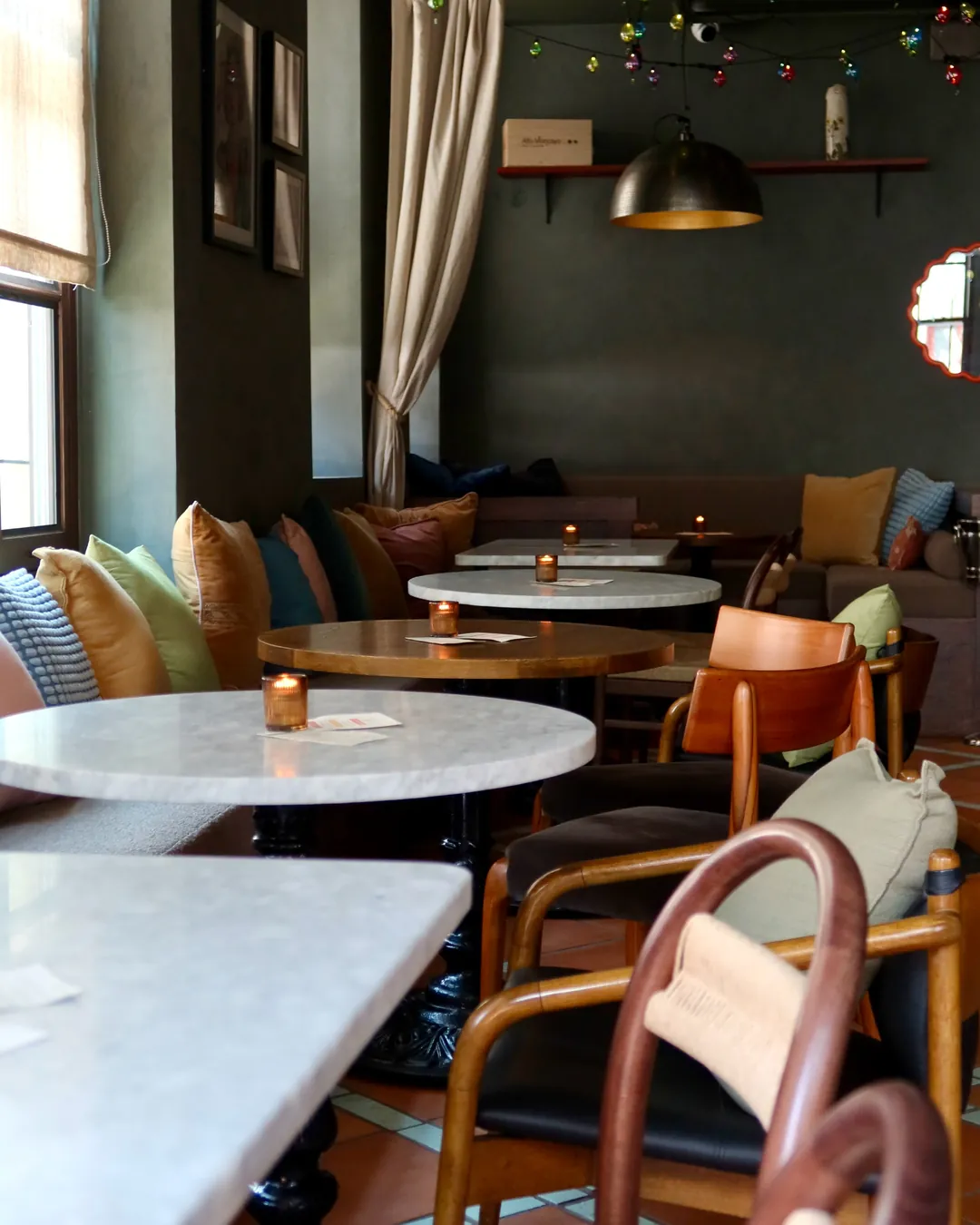 Safi's lounge seating by the windows, set for a private gathering